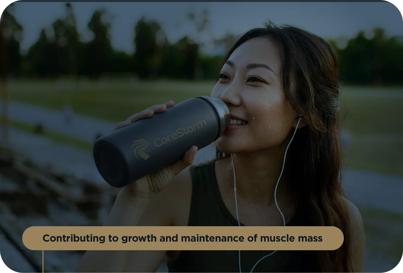 Woman drinking from a CoreStorm water bottle outdoors